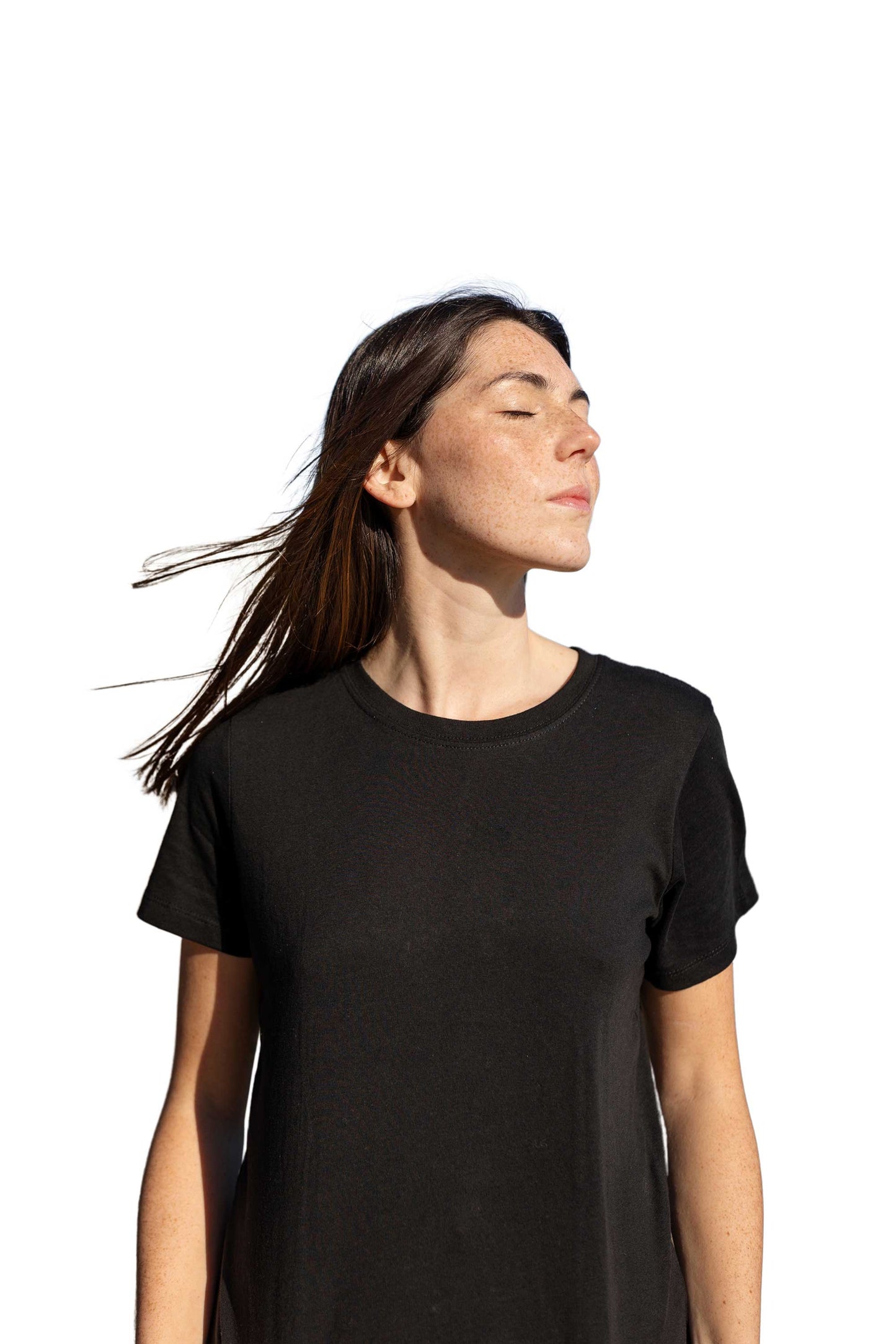 Person wearing a black t-shirt against a white background