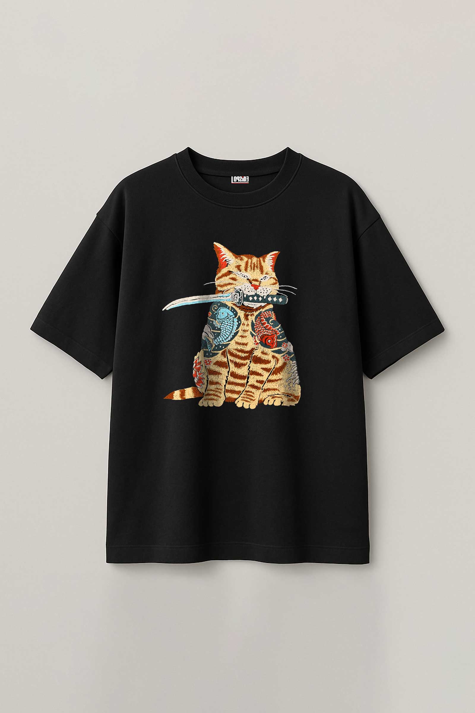 Black t-shirt with a cat graphic design on a light gray background